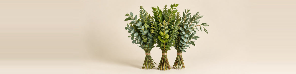 Greenery & Foliage — three bunches of mixed green foliage stems loosely tied