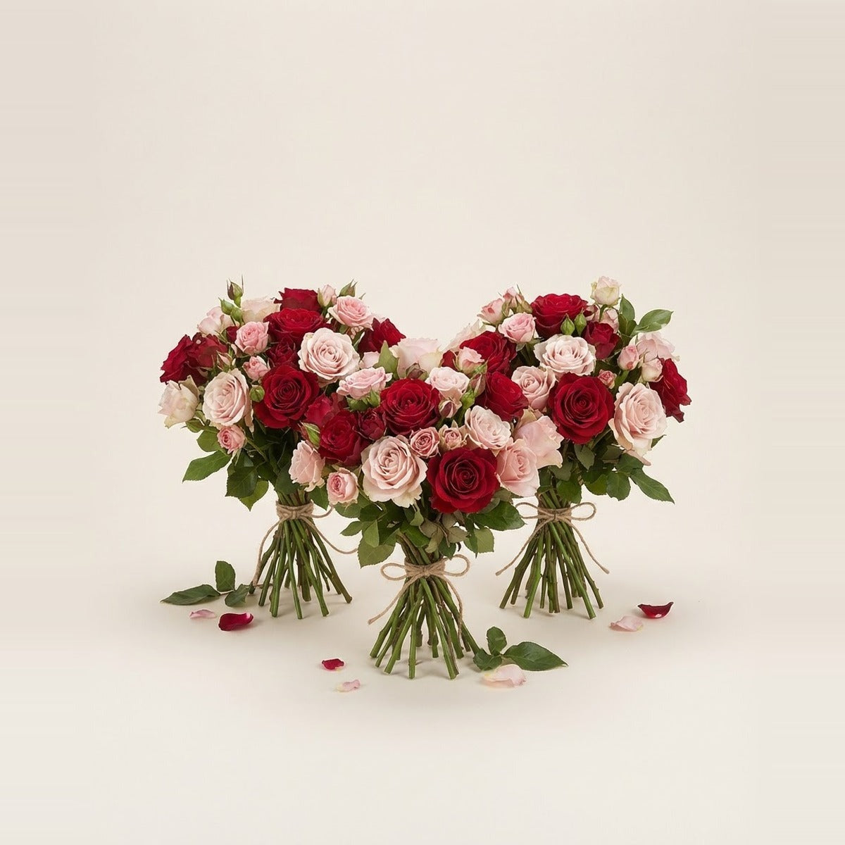Love & Anniversary Flowers — three bunches of red and pink romantic roses loosely tied