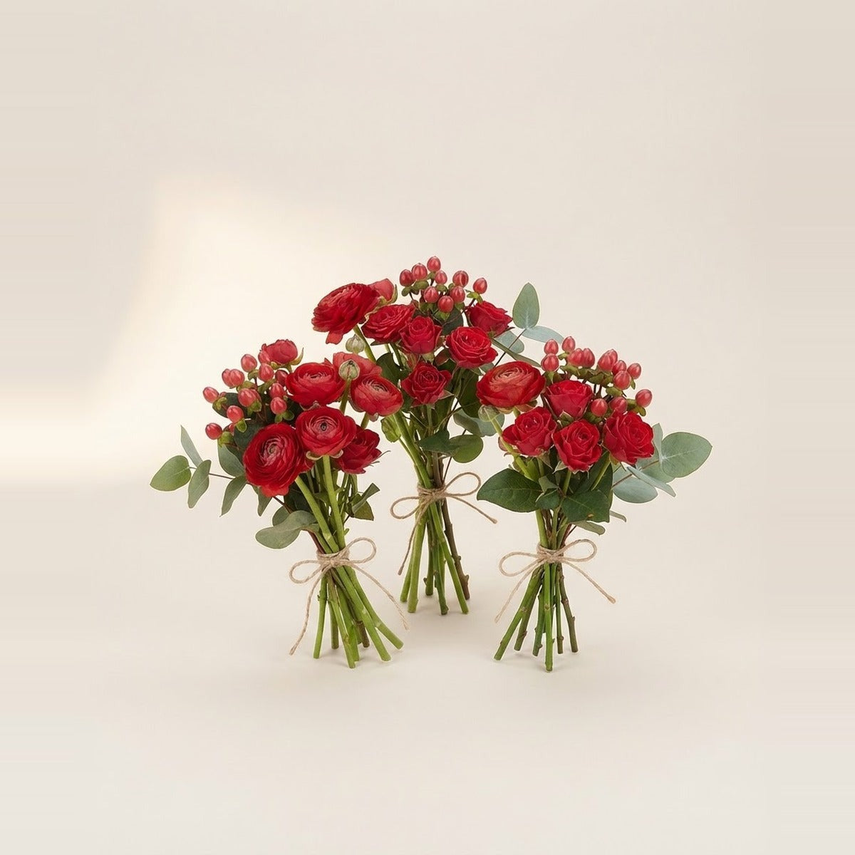 Red Flowers — three bunches of red flowers loosely tied