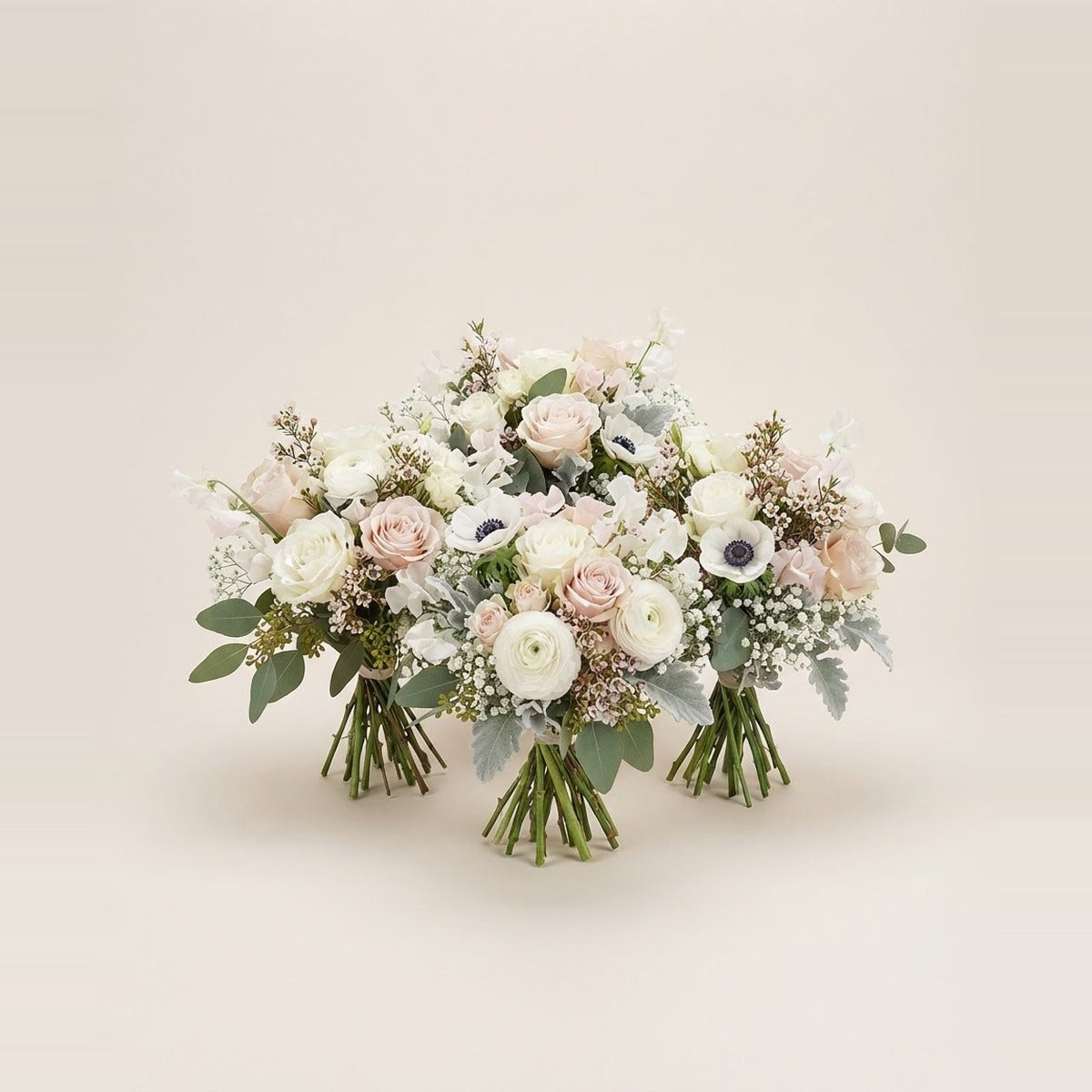 Wedding Flowers — three elegant white and blush bridal flower bunches