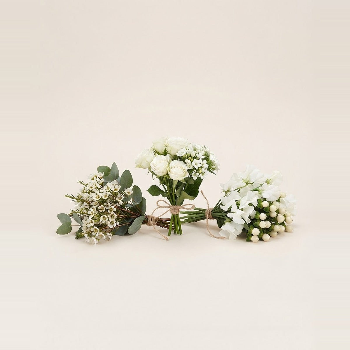White Flowers — three bunches of white flowers loosely tied