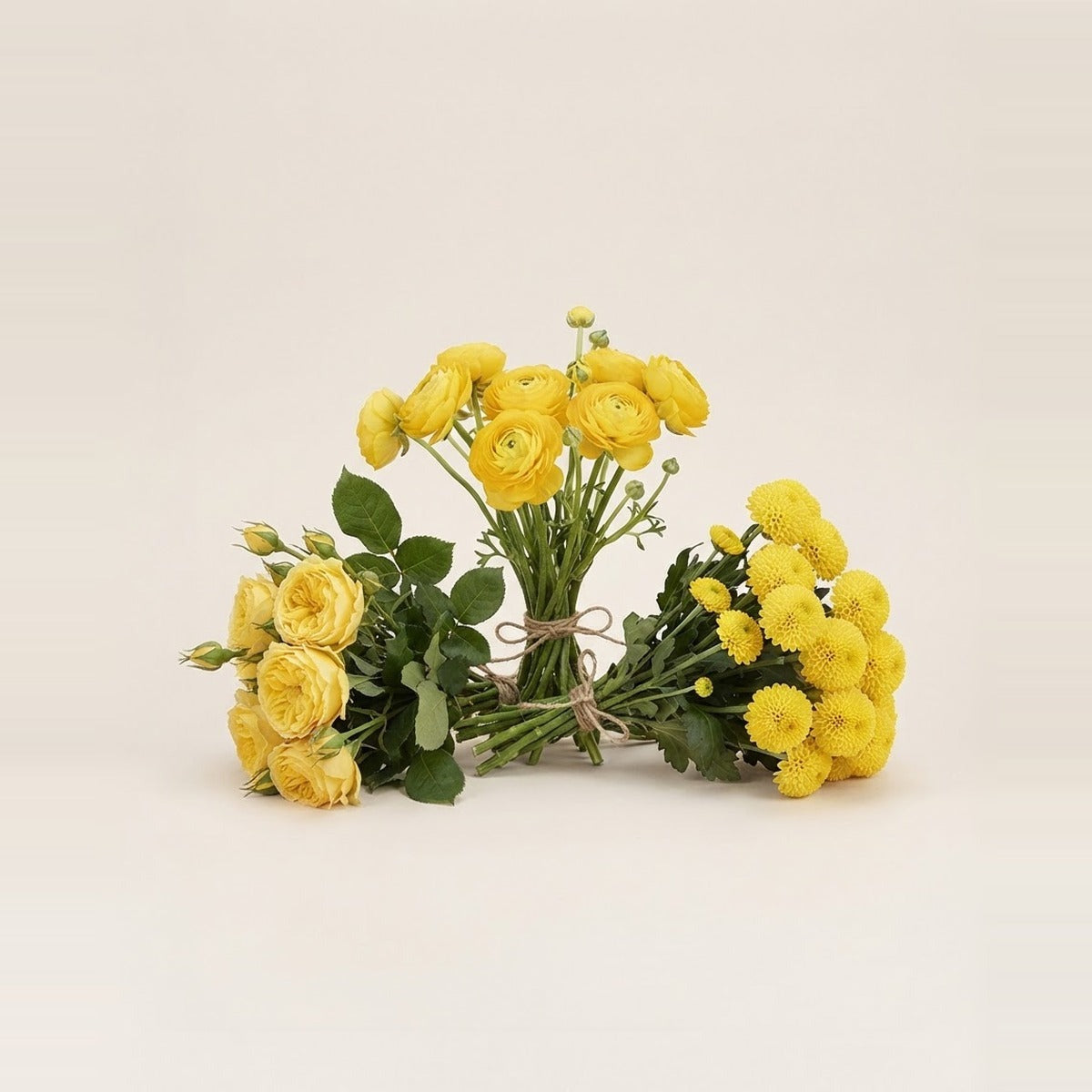 Yellow Flowers — three bunches of yellow flowers loosely tied