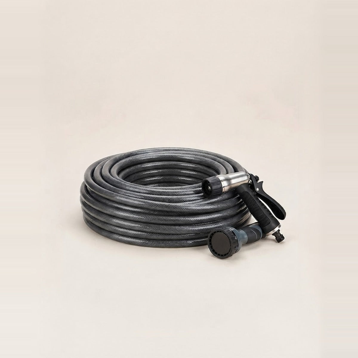 Hoses & Nozzles — a coiled garden hose with two spray nozzles beside it
