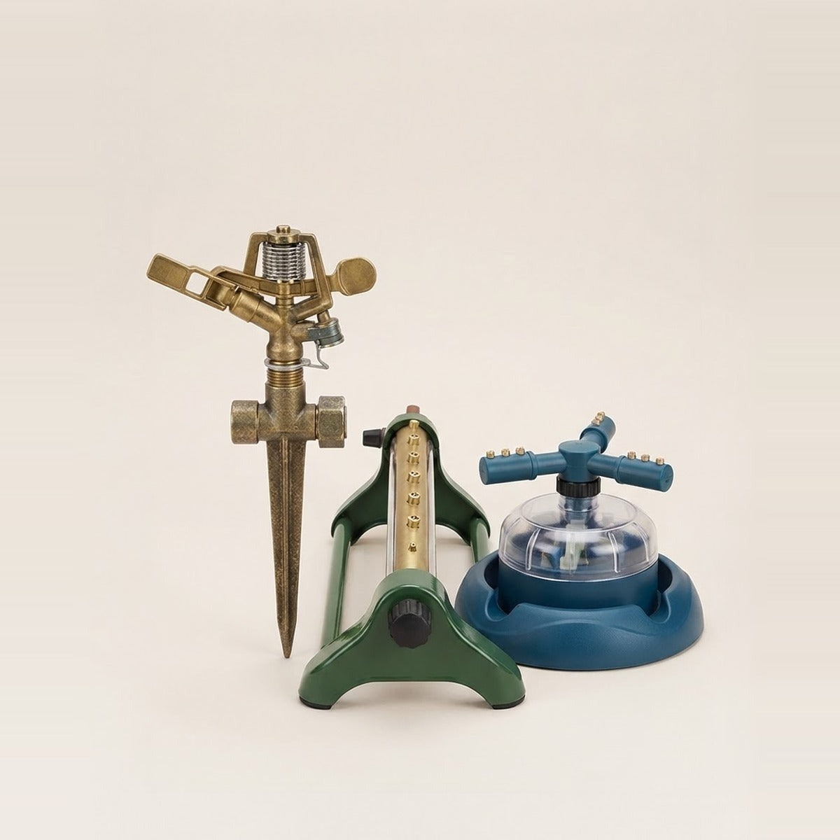 Sprinklers — two garden sprinklers of different types standing on a cream floor
