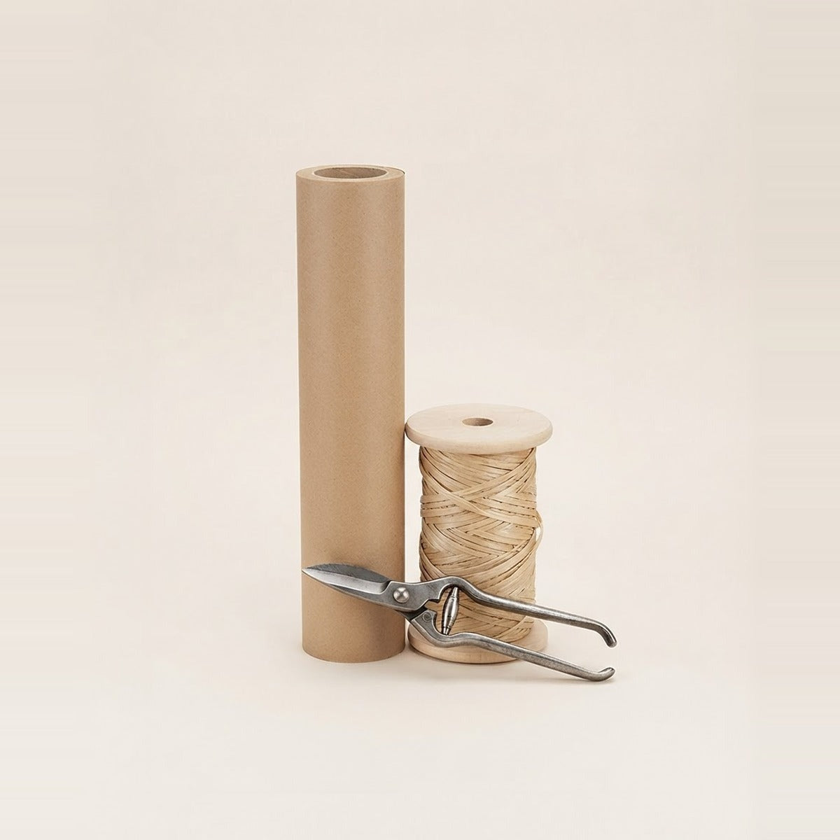 Flower Accessories — fresh flower accessories - a cream ceramic vase, floral foam block, a spool of natural twine and floral snips