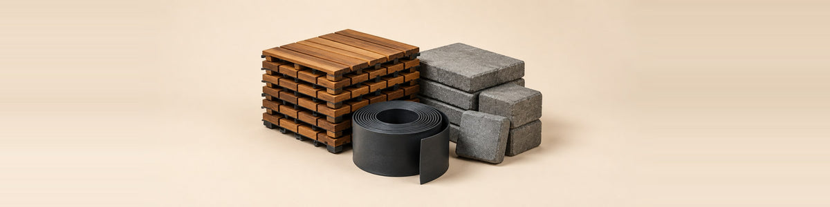 Garden Landscaping & Decking — landscaping materials - a stack of wooden decking tiles, grey paving stones and a roll of garden edging
