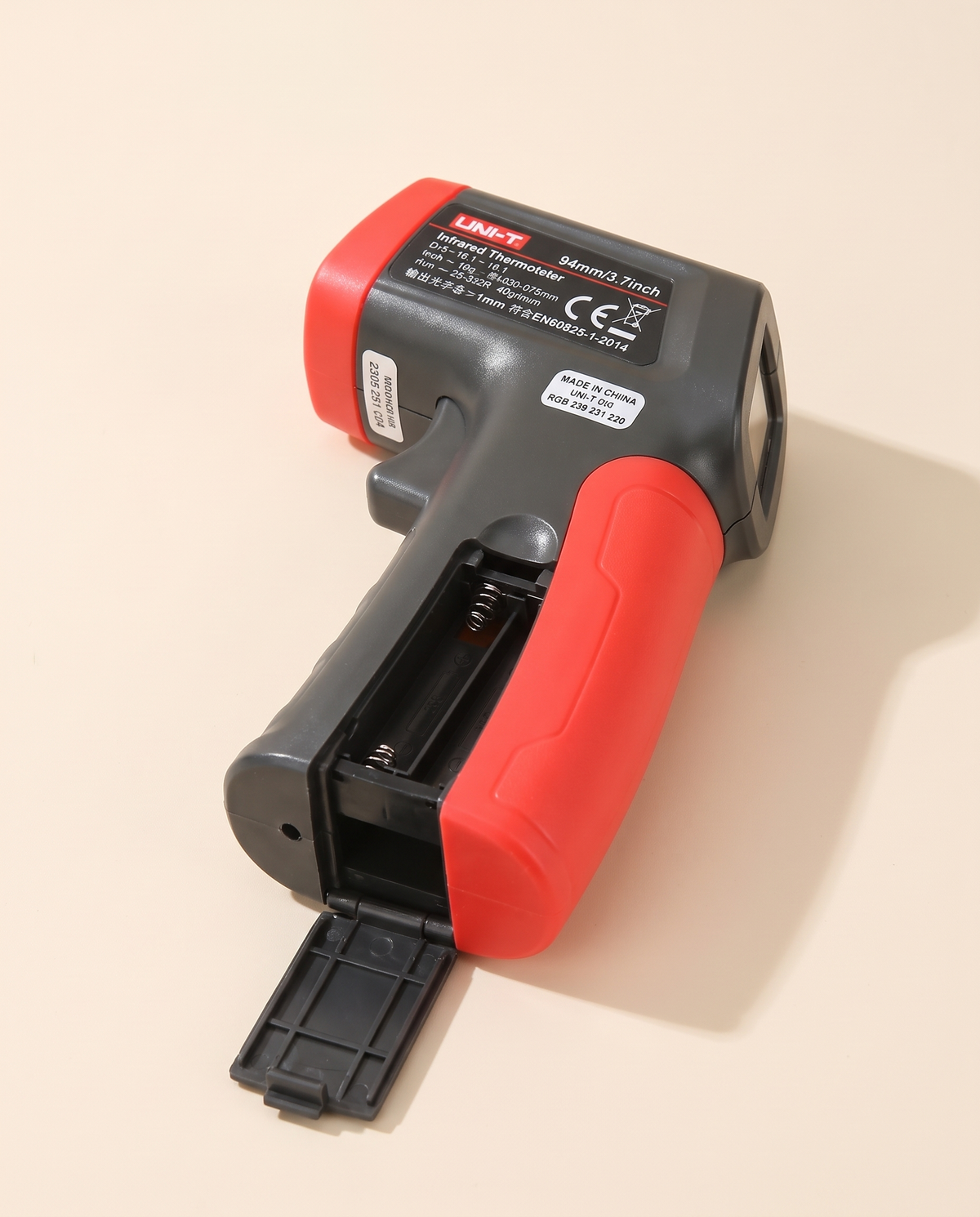 Infrared thermometer gun with battery compartment open